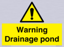 warning-drainage-pond~